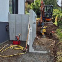 Mauerscheiben und Bagger